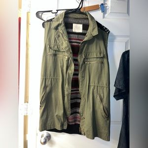 Green cargo vest with stretchy sweater back